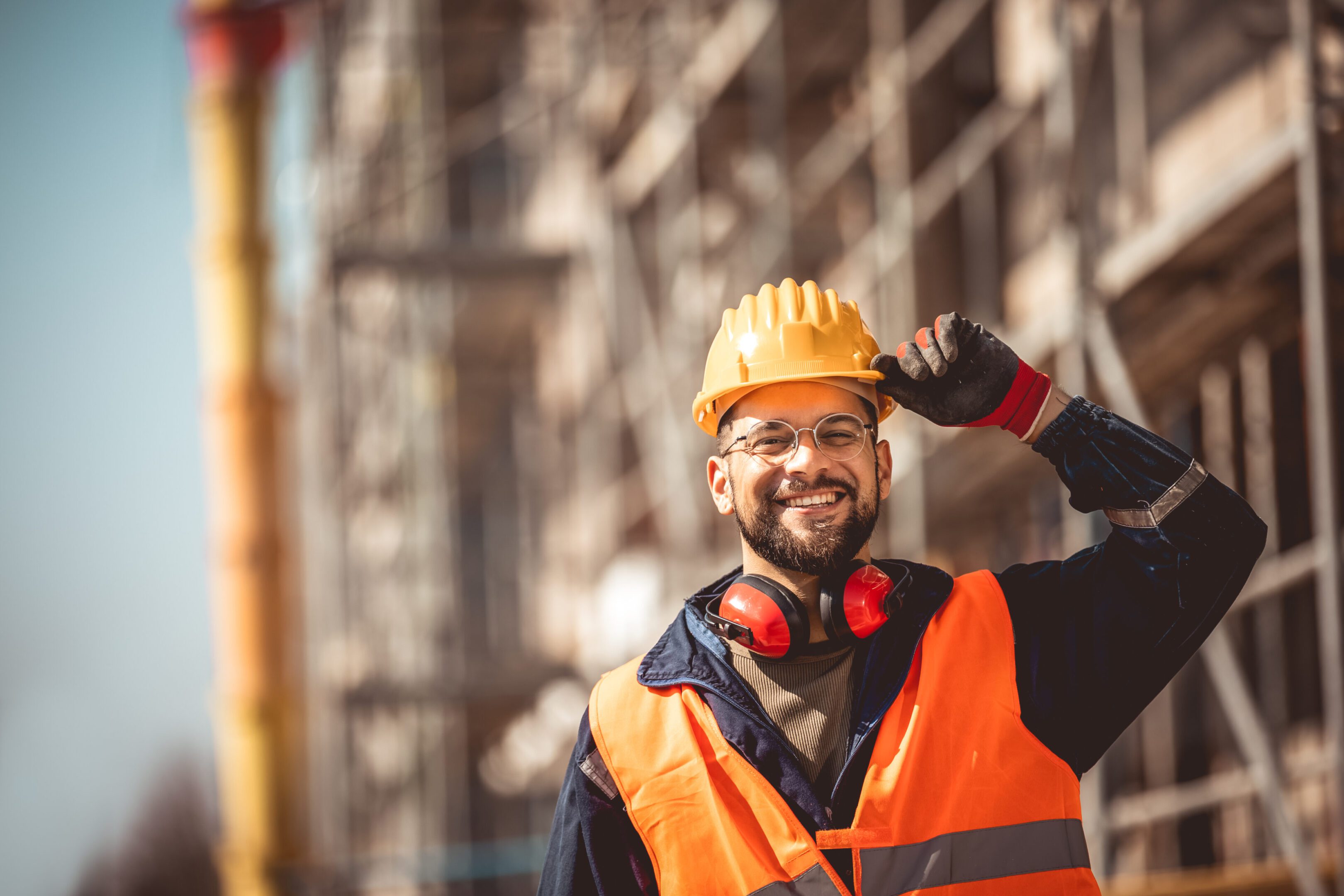 Smiling construction worker in safety gear.